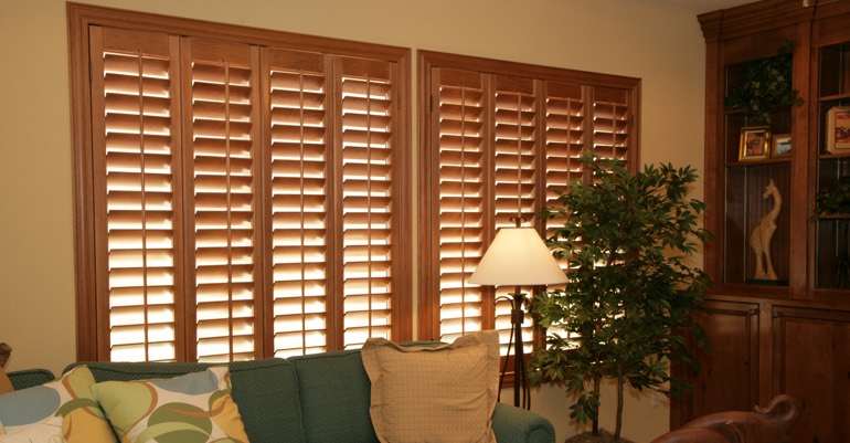 Natural wood shutters in Charlotte living room.